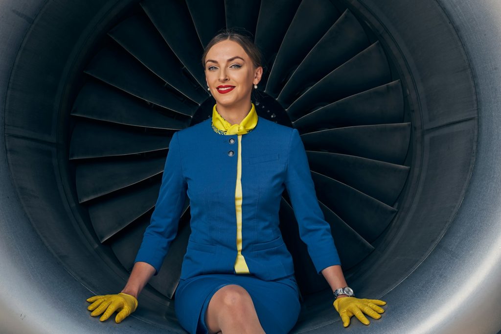 Smiling flight attendant posing for the camera